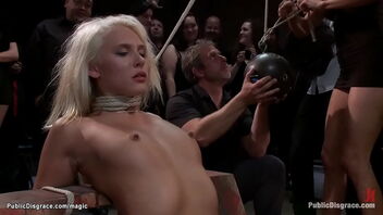 Public display of restrain bondage and domination with a blonde pornstar