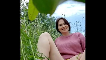 Angela, a mature woman, in a chamomile field has a sensual practice that includes self-pleasure, urination and the removal of a wasp.