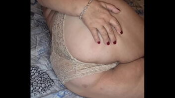 An amateur Mummy shares her big chest and shaven twat in a panty shot.